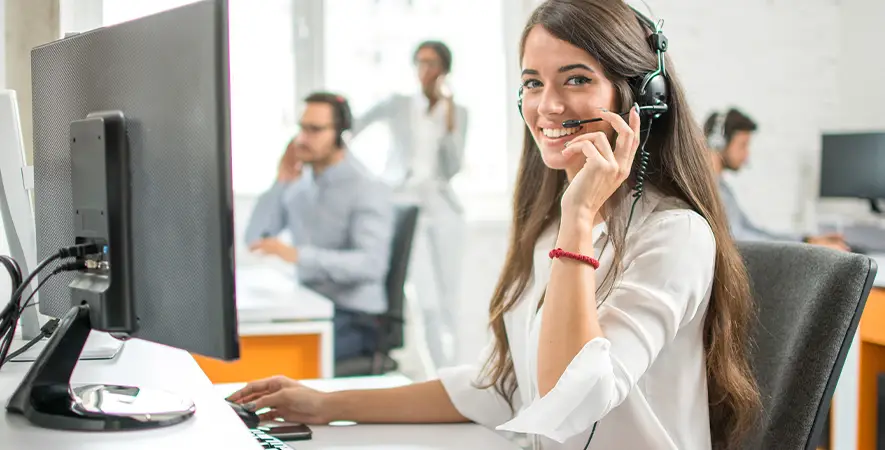Friendly Payment Expert with a headset ready to help merchants.