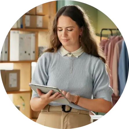 business owner reviewing payment processing statements on a tablet