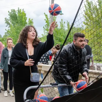 Sekure employees competing in a free throw contest at a company bbq