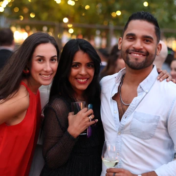 Three Sekure employees posing together for a picture at a company event