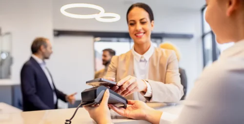 accepting payment by tapping a phone to a handheld payment terminal
