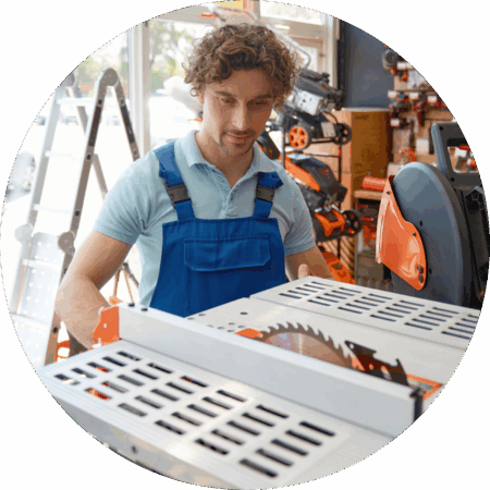 customer in a hardware store looking at a purchasing a table saw