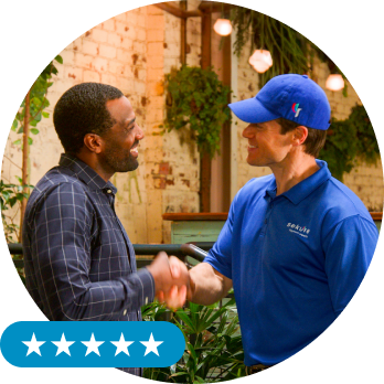 Sekure employee shaking hands with a business owner who has become a Sekure customer