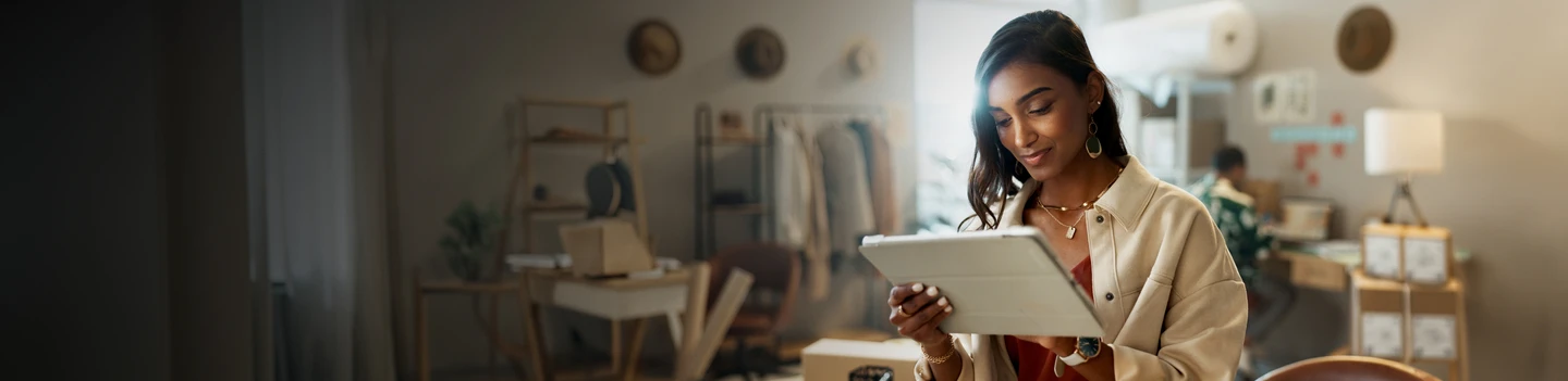 retail store owner using their tablet to organize their store inventory and orders